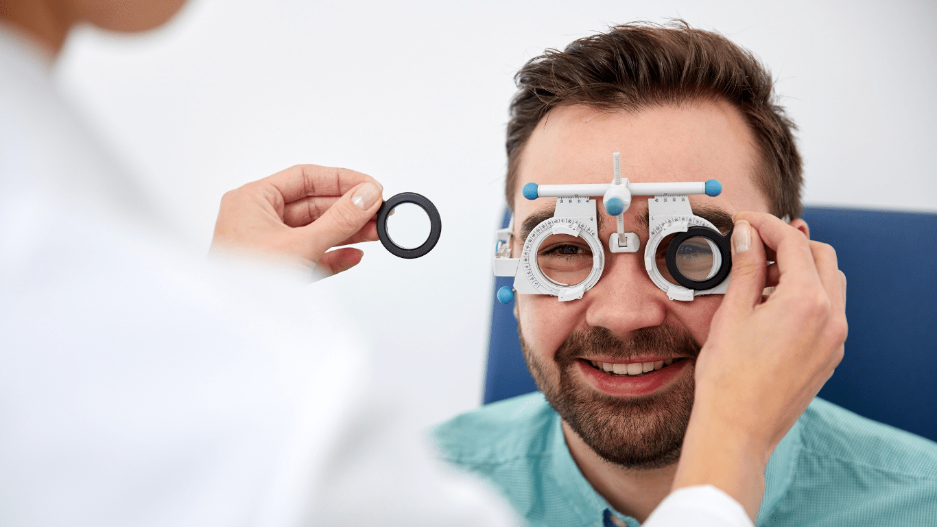 Bernhardt Vision website homepage image - a man having his eye care service testing glasses and lenses